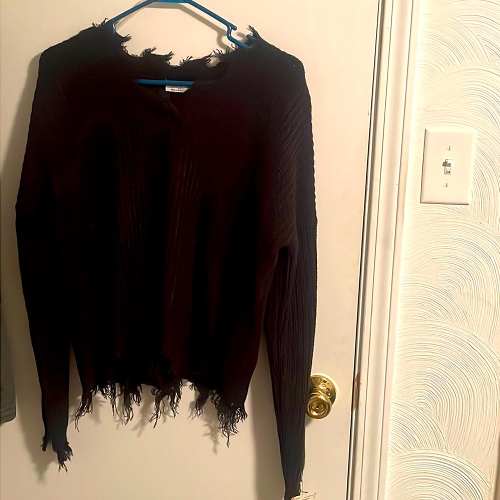 Full circle trends cropped sweater with frilly edges!
